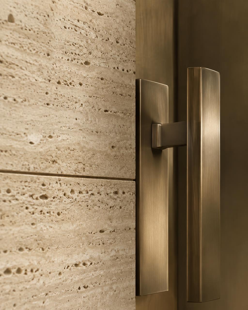 Travertine and bronze entry detail